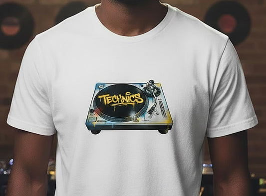 White t-shirt with Technics turntable graffiti graphic worn by a person, with vinyl records in the background.